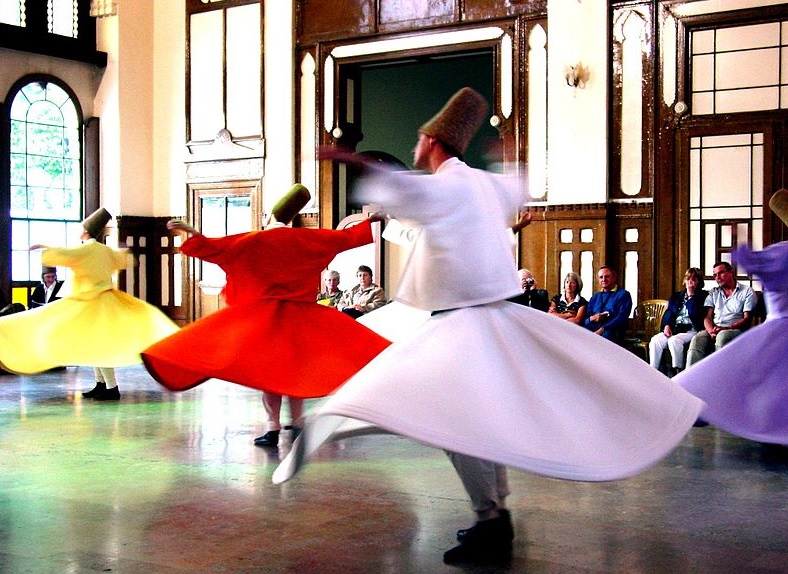 A couple dancing in an informal setting. 