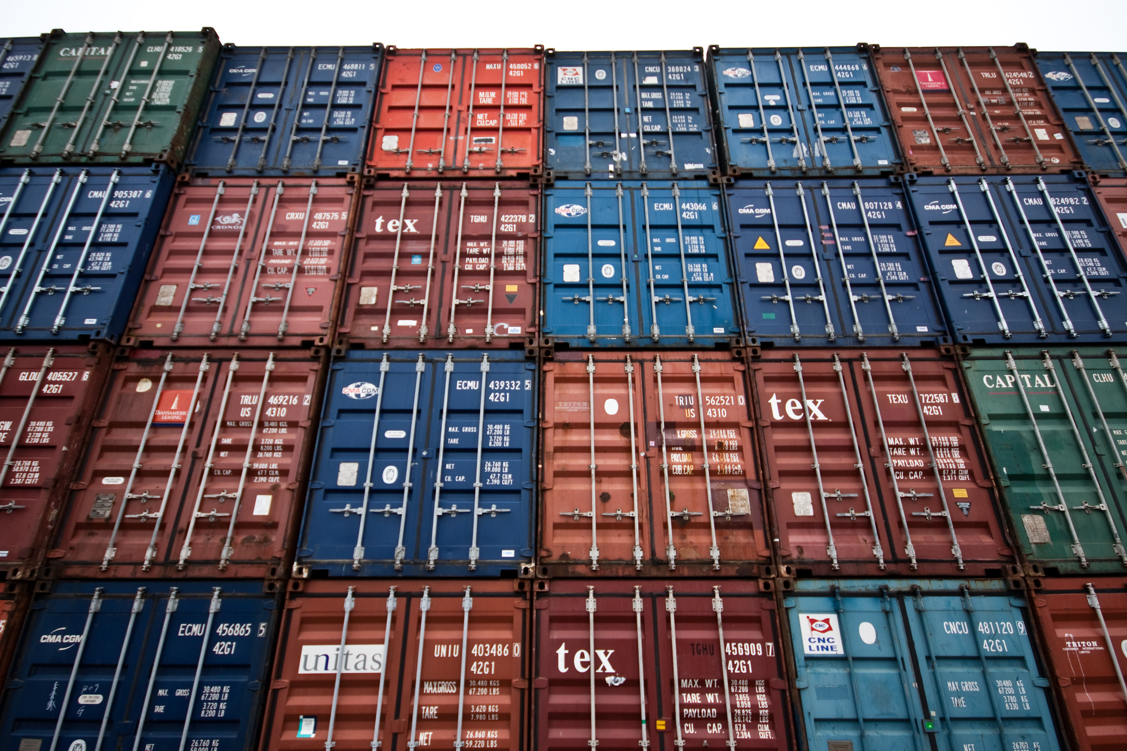 Towers of multicolored shipping containers.