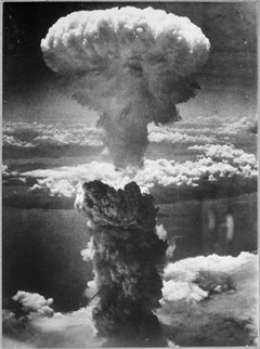 A dense column of smoke rises more than 60,000 feet into the air over the Japanese port of Nagasaki