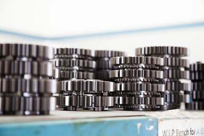 An image of a stack of cogs to represent the manufacturing process.