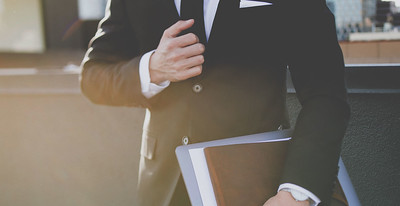 Photo of a financial advisor holding a portfolio